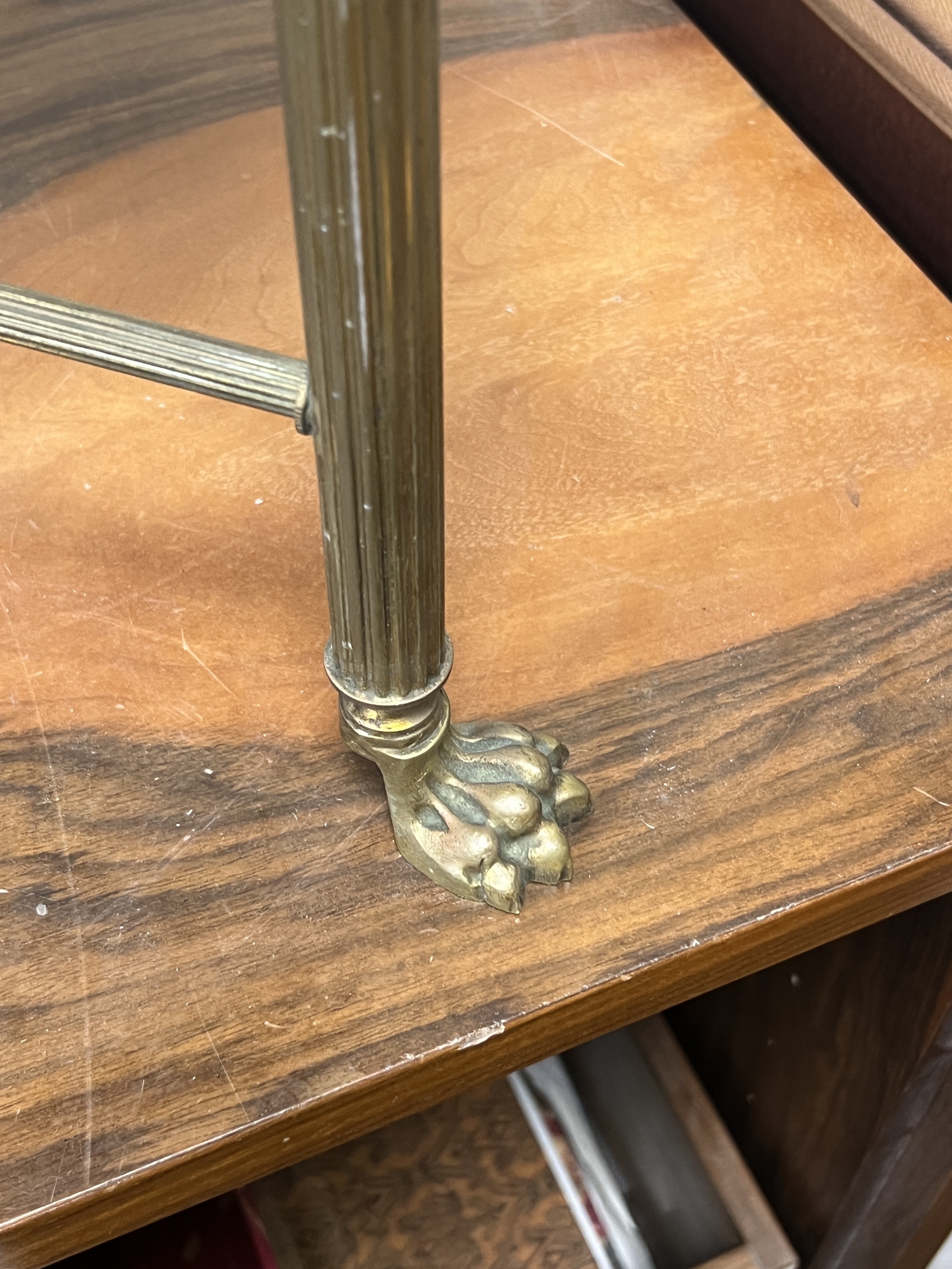 A mid century rectangular brass and mahogany leather topped coffee table with lion paw feet, width 107cm, depth 44cm, height 38cm